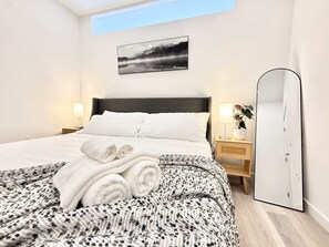 1 bedroom, desk, iron/ironing board, travel crib