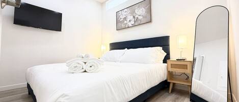 1 bedroom, desk, iron/ironing board, travel crib