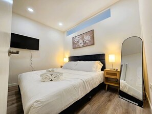 1 bedroom, desk, iron/ironing board, travel cot