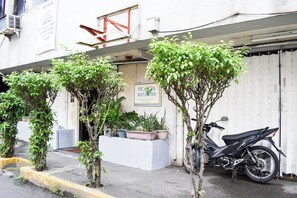 A building with a sign for "Victoria Mansions" and a parked motorcycle. - Victoria Mansions By Zuzu (Manila)