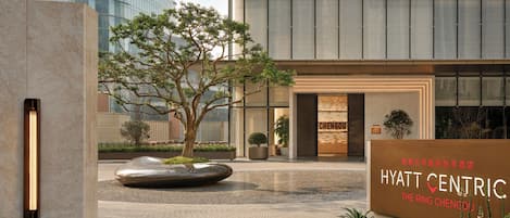 A modern hotel entrance with a large sign for 'Hyatt Centric The Ring Chengdu.'