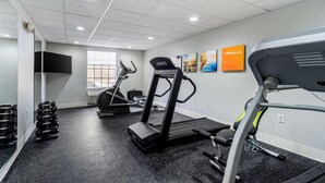 A gym with treadmills, dumbbells, and a mirrored wall. - Comfort Inn & Suites Lexington South (Lexington)