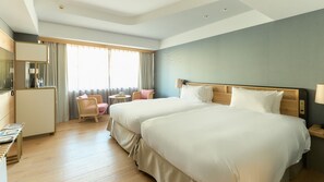 A hotel room with two beds, a desk, a chair, and a window with curtains. - Good Nature Hotel Kyoto (Kyoto)