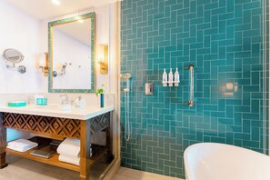 A bathroom with a white sink, a large mirror, a shower with a glass door, and a white bathtub. - Margaritaville Island Reserve Riviera Maya (Puerto Morelos)
