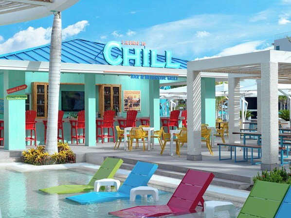A poolside area with colorful lounge chairs, a bar and beachside grill, and a building with a 'CHILL' sign. - Margaritaville Island Reserve Riviera Maya (Puerto Morelos)
