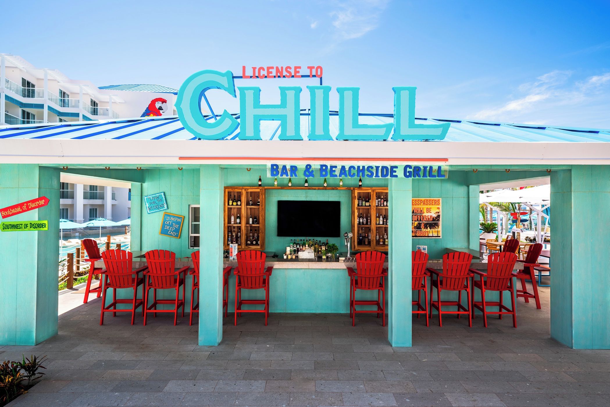 A bar and beachside grill with a sign reading "License to Chill".