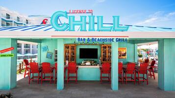 A bar and beachside grill with a sign reading "License to Chill".