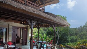A traditional thatched-roof pavilion with a pool and seating area, surrounded by lush greenery. - Sakti Garden Resort & Spa (Ubud)