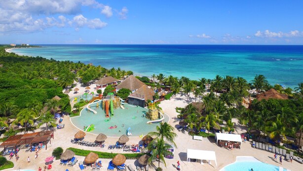 A resort with a pool area, palm trees, and a beach. - Family Selection At Grand Palladium Kantenah (Kantenah)