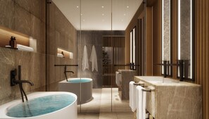 Ein modernes Badezimmer mit einer freistehenden Badewanne, einer separaten Duschkabine und einem Waschtisch mit großem Spiegel.