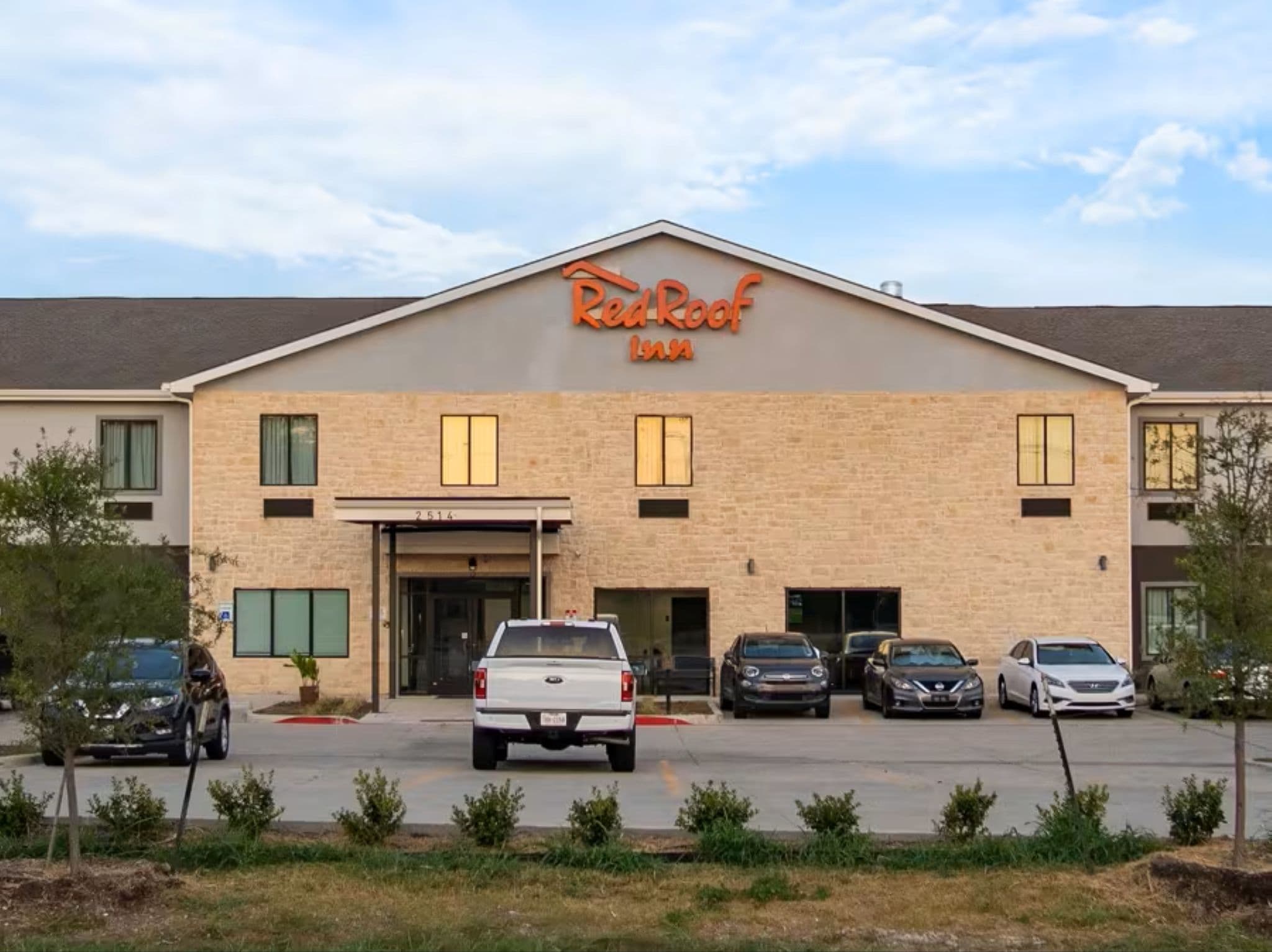 A building with a sign reading "Red Roof Inn".