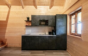 Fridge, stovetop, dishwasher, coffee/tea maker