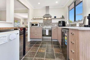 Coffee/tea maker, fridge, microwave, oven