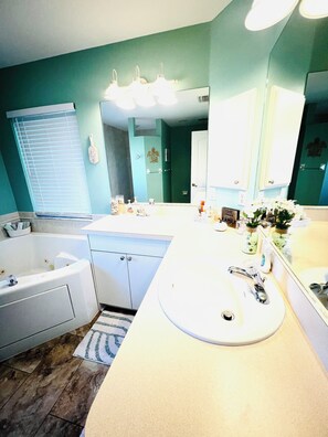 Jetted tub, hair dryer, towels, soap