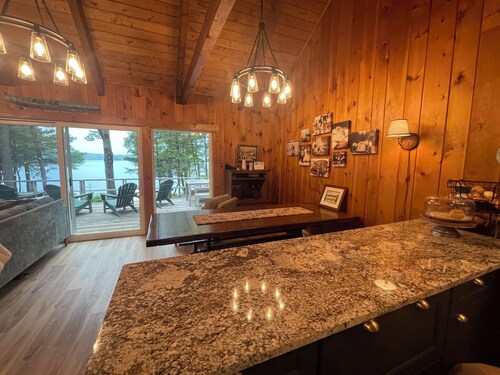 Relax in the glow of a campfire at this waterfront cottage on Thompson Lake