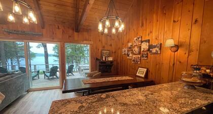 Relax in the glow of a campfire at this waterfront cottage on Thompson Lake