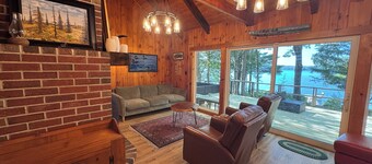 Relax in the glow of a campfire at this waterfront cottage on Thompson Lake