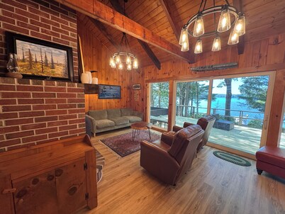 Relax in the glow of a campfire at this waterfront cottage on Thompson Lake