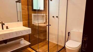 Shower, hair dryer, soap, toilet paper