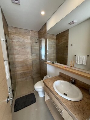 Shower, towels, soap, toilet paper