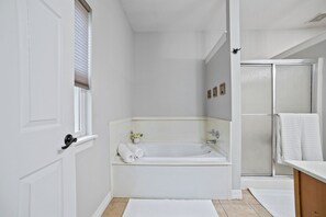 Jetted tub, hair dryer, towels, soap