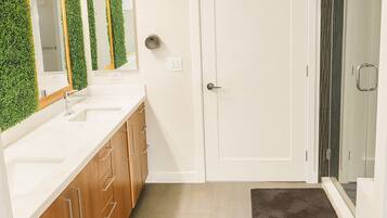 Shower, hair dryer, towels, toilet paper