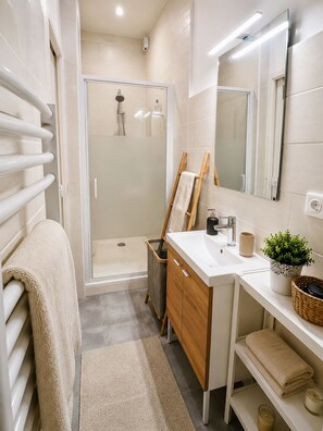 Shower, hair dryer, towels, soap