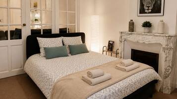 1 bedroom, desk, iron/ironing board, travel crib