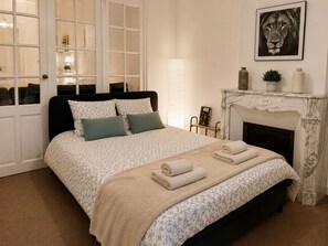1 bedroom, desk, iron/ironing board, travel crib