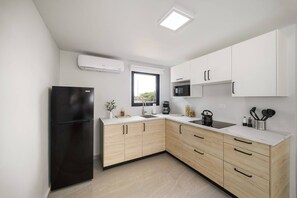 Fridge, microwave, stovetop, coffee/tea maker