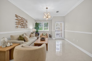 Luxury Townhome, 3 Bedrooms, Courtyard View | Living area | 65-inch Smart TV with digital channels