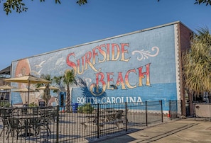 A mural of 'Surrside Beach' in South Carolina on a building. - Peaceful 2-bedroom condo at the beach with a water view! (Surfside Beach)