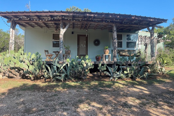 Sip your coffee on this lovely front porch.