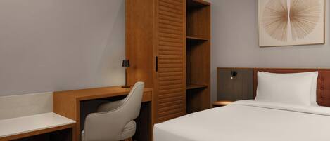 Une chambre à coucher comprenant un lit, un bureau, une chaise, une armoire et une œuvre d’art accrochée au mur.