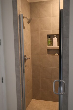 Shower, towels, soap, toilet paper