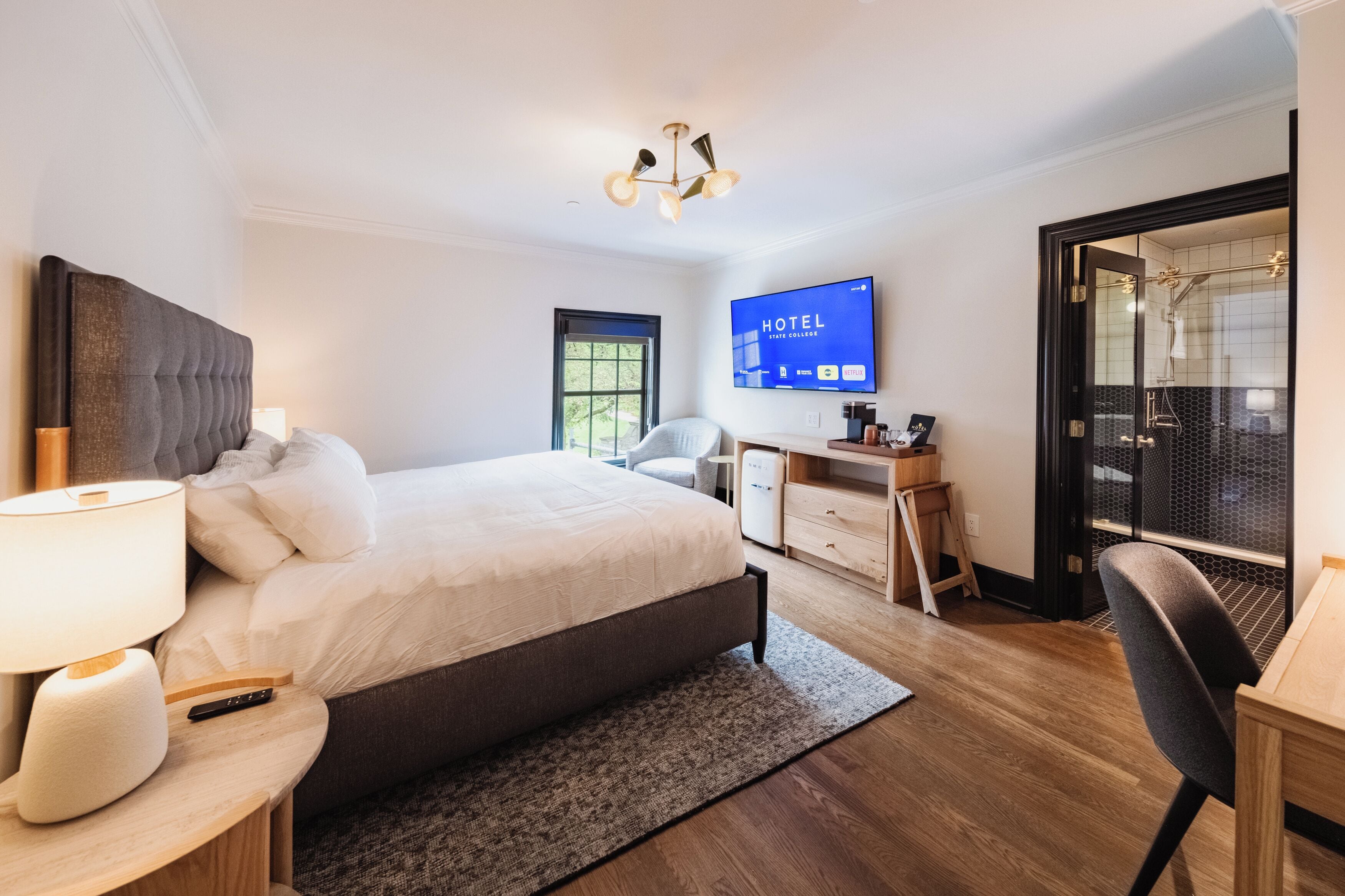 Deluxe King - College View | Individually decorated, individually furnished, blackout drapes