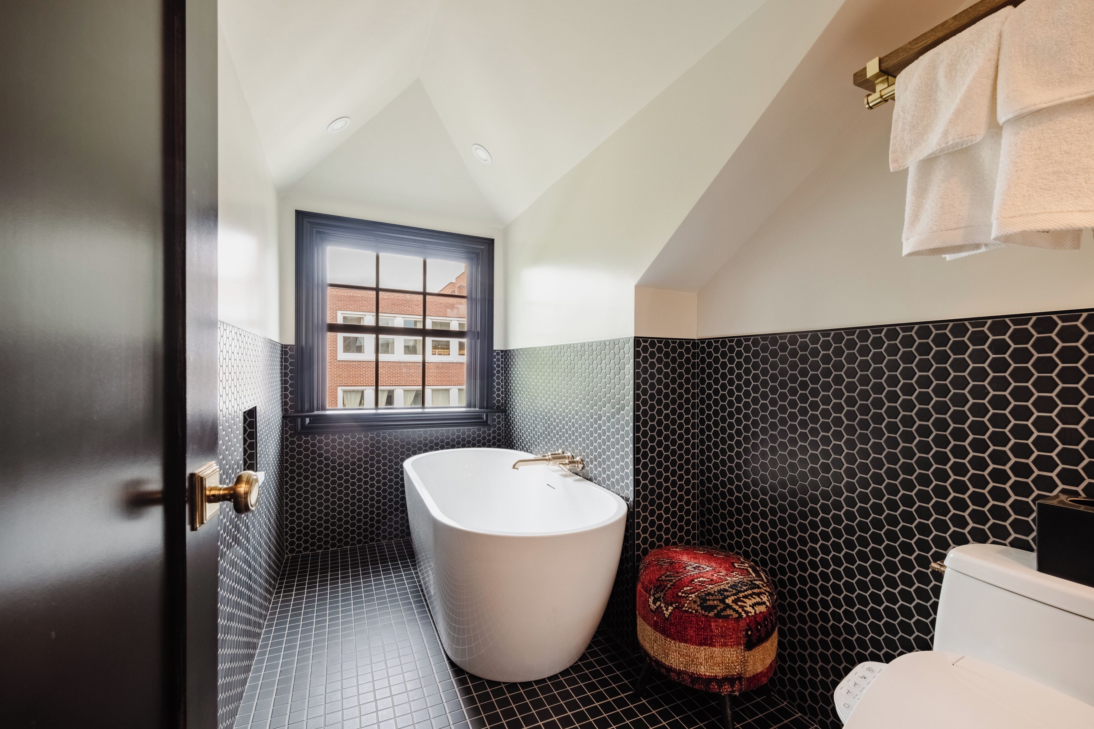 Deluxe King - Allen Street View | Bathroom | Separate tub and shower, hair dryer, towels, soap