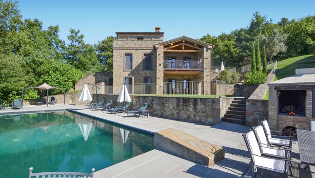 A stone building with a pool, outdoor seating, and a barbecue area. - Amazing home in Lisciano Niccone (Lisciano Niccone)