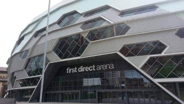 A modern building with a geometric facade and the text "first direct arena" on the lower part. - Luxury modern flat • close to city • free parking (Leeds)