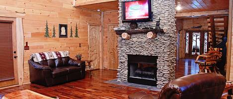 Televisio, takka, DVD-soitin, pöytäjalkapallopöytä