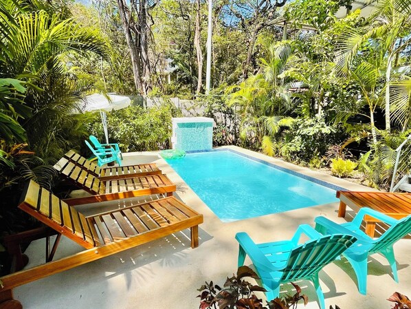 Outdoor pool, pool umbrellas, sun loungers