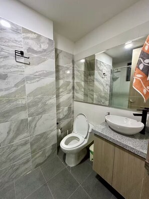 Shower, towels, soap, toilet paper