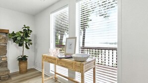 A room with a wooden desk, a potted plant, and a window with blinds. - Hot Tub, Main Channel Views, Great Outdoor Spaces, Blackstone (Sunrise Beach)