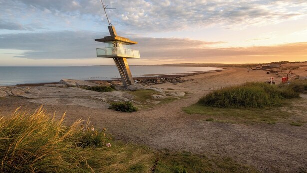A coastal landscape with a unique, modern lookout tower structure. - Östra Stranden by Interhome (Halmstad)