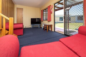 Classic Cabin, River View | Living area | 32-inch LCD TV with cable channels - BIG4 Kelso Sands Holiday and Native Wildlife Park (Kelso)