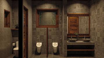 A modern bathroom with two urinals, a toilet, and a vanity with two sinks.