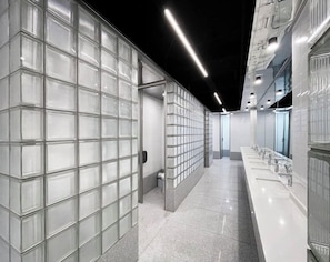 Shower, hair dryer, towels, shampoo