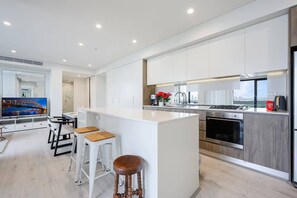 Fridge, microwave, oven, stovetop - MetawiseBnB Executive 2-Bedroom Stadium View Apartment W Parking (Lidcombe)