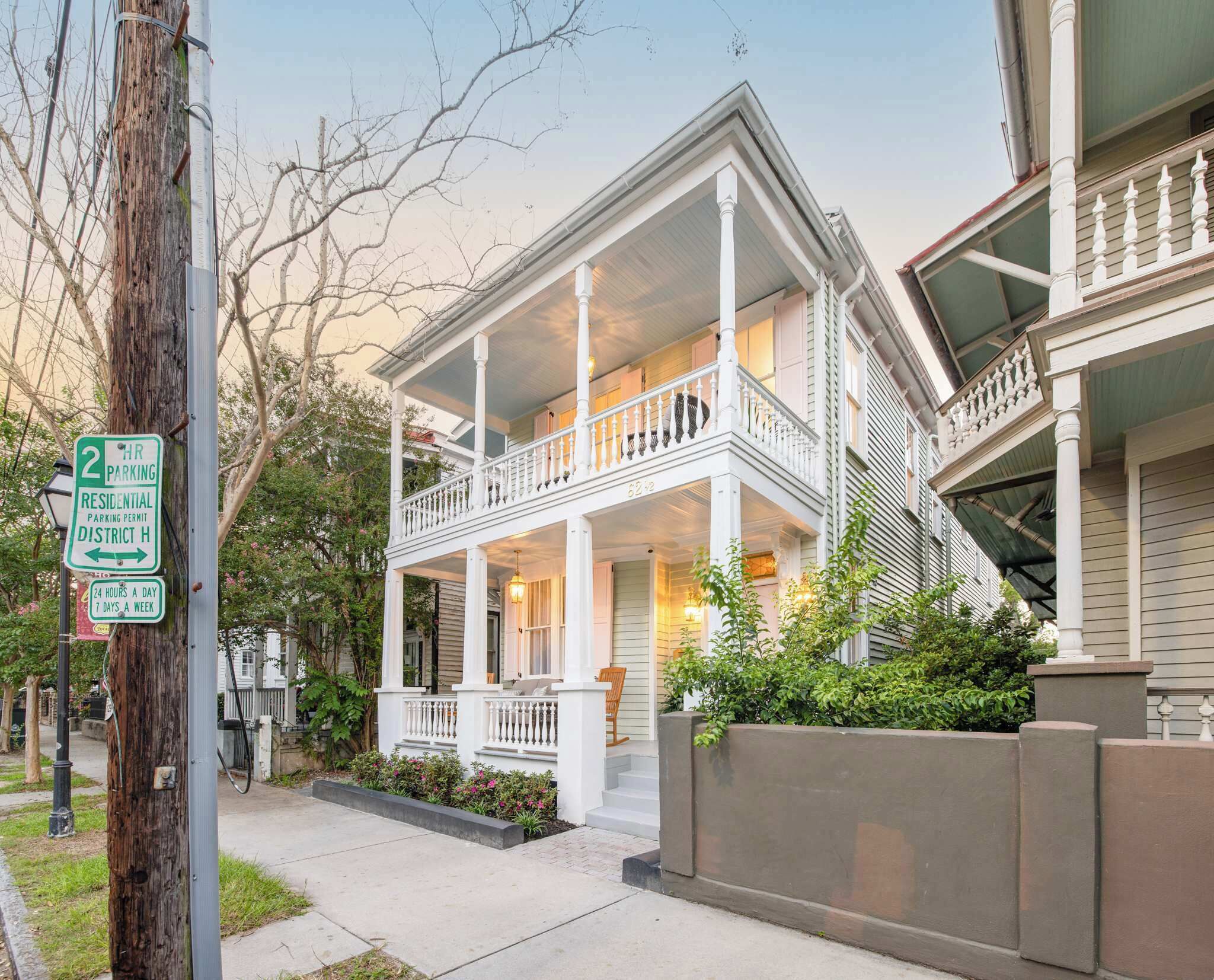 A two-story house with a porch and a balcony.