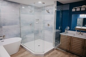 Shower, hair dryer, towels, shampoo
